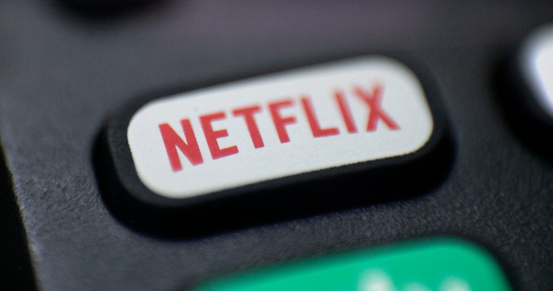 FILE - This Aug. 13, 2020 photo shows a logo for Netflix on a remote control in Portland, Ore.  Netflix’s rapid subscriber growth is slowing far faster than anticipated, Tuesday, April 20, 2021, as people who have been cooped at home during the pandemic are able to get out and do other things again. The video streaming service added 4 million more worldwide subscribers from January through March, its smallest gain during that three-month period in four years.   (AP Photo/Jenny Kane, File)