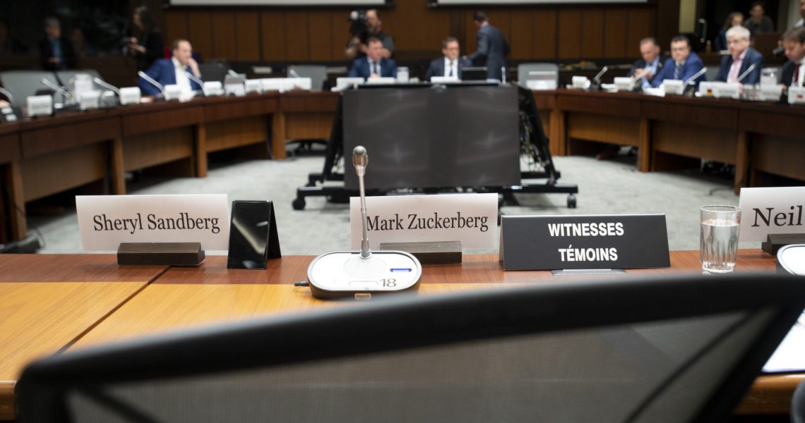 An empty chair sits behind the name tags for Facebook's Mark Zuckerberg and Sheryl Sandberg as the International Grand Committee on Big Data, Privacy and Democracy waits to begin in Ottawa, Tuesday May 28, 2019. THE CANADIAN PRESS/Adrian Wyld